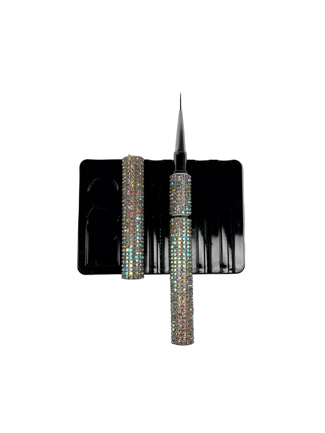 Builder gel liner brush with crystal handle on a black card against a white background