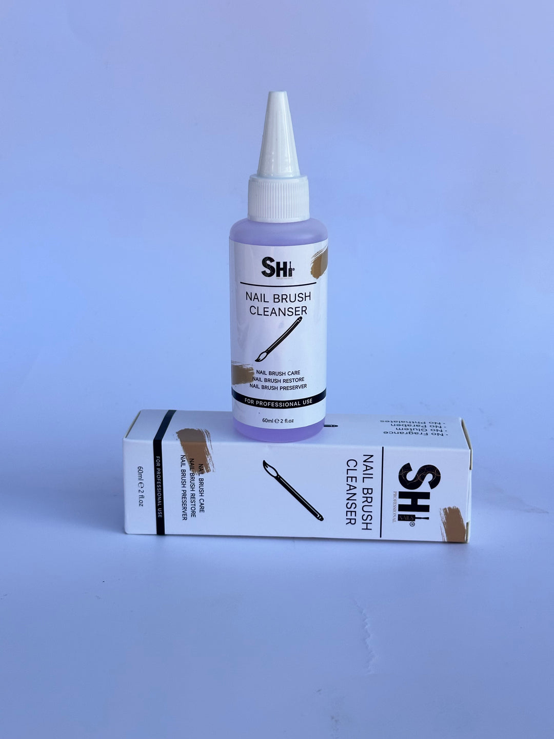 The image shows a Kolinsky Nail Brush Cleanser Solution displayed on a white box surface. SHi® brand visible
