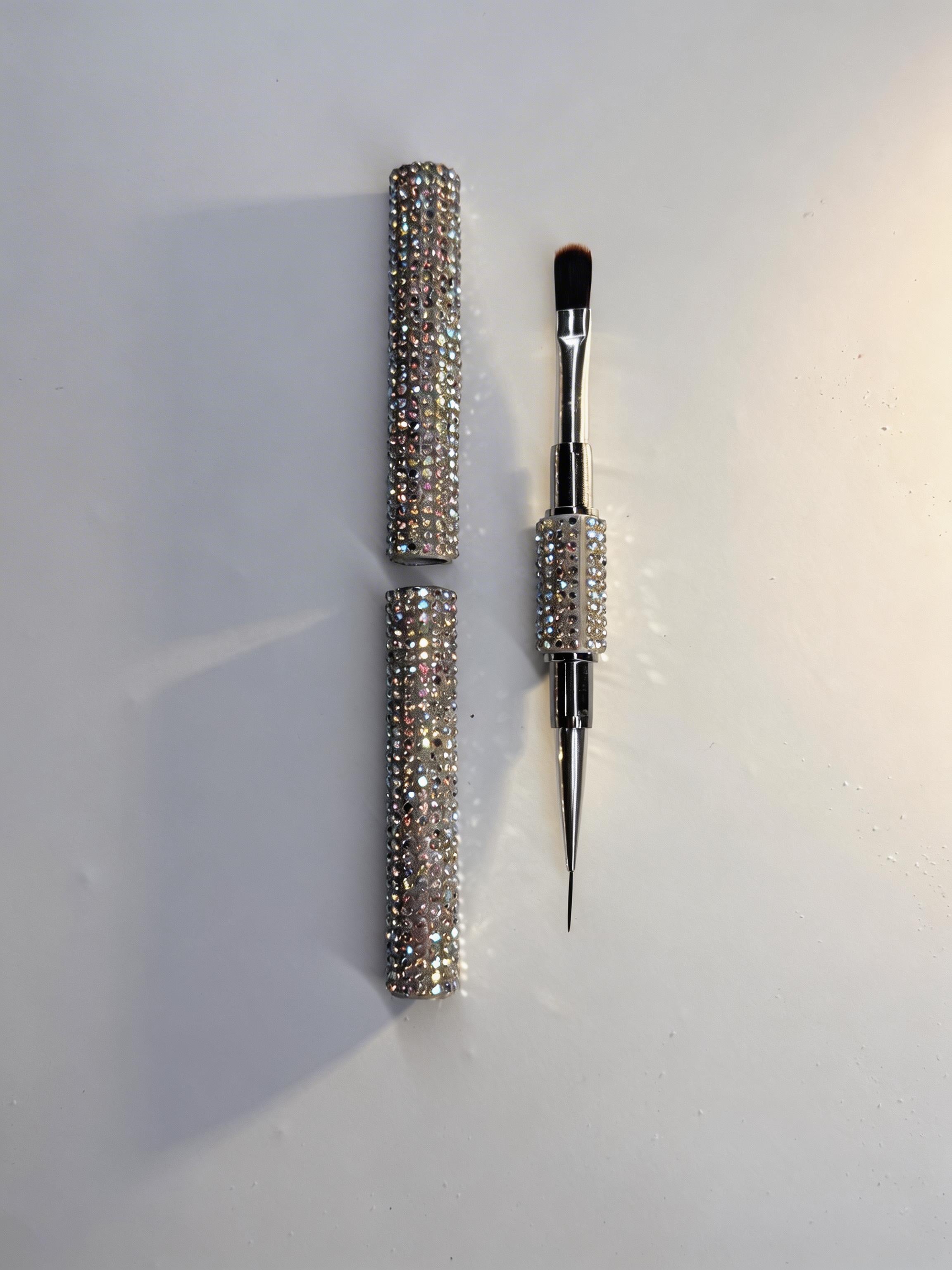 a builder gel dual-ended round brush with crystal handle on a white background