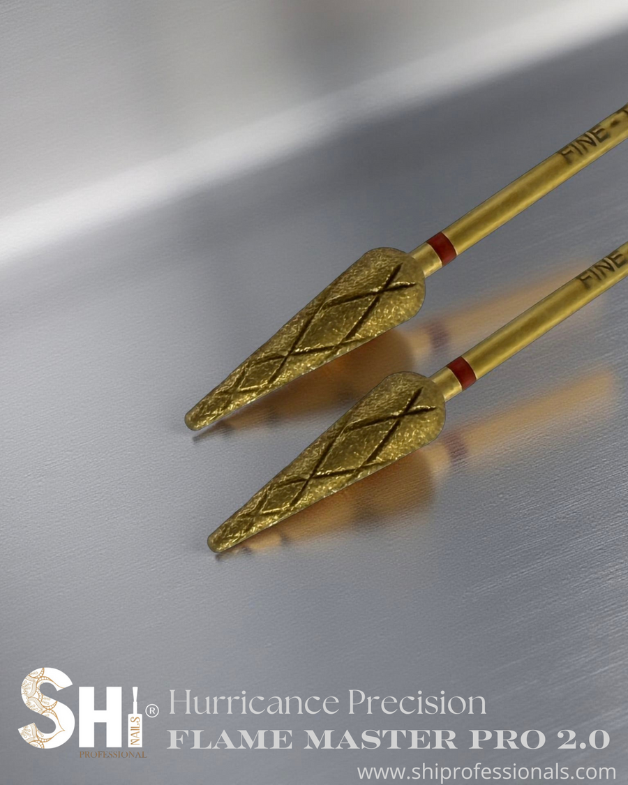 Two gold flame master pro 2.0 bits with red band on a metallic surface, featuring the SHI logo.