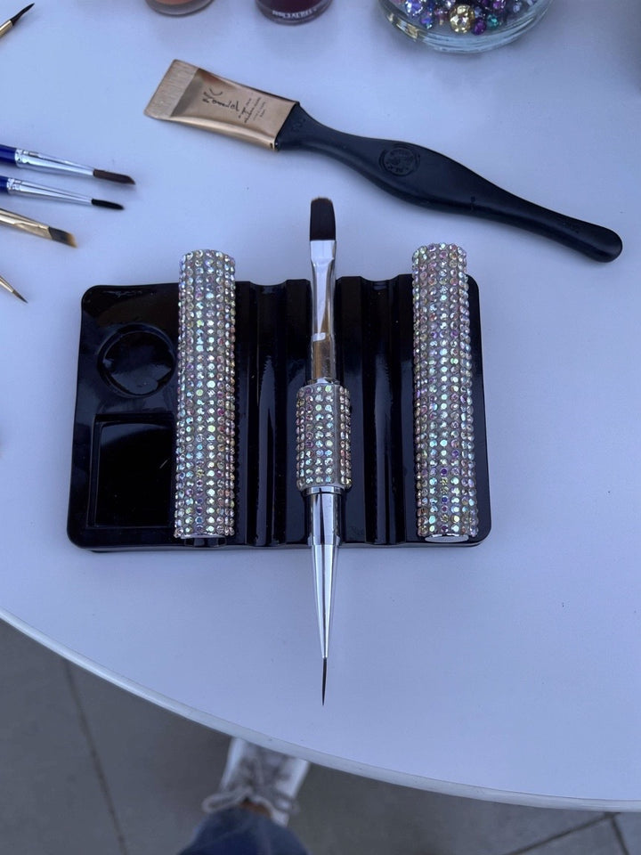 Builder gel round brushes with crystal  embellishment handles on a white surface
